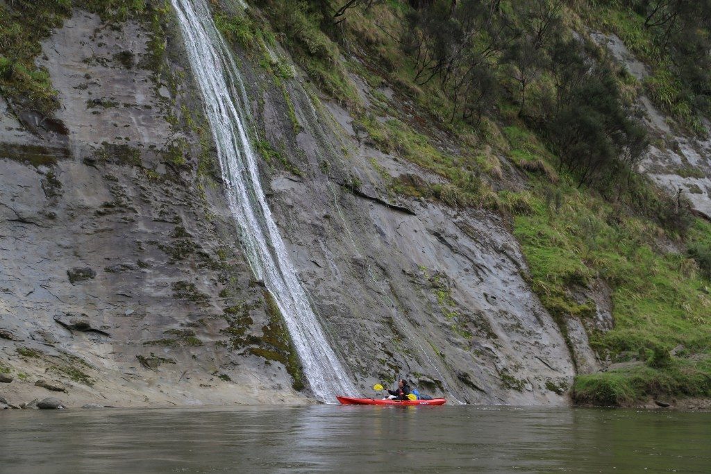 A kayaker goes for a shower south of Whakahoro . Photo: Matthew Pike
