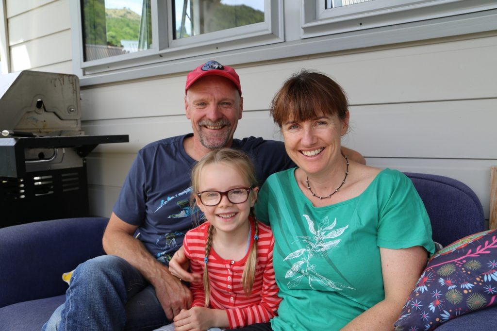 Georgie back at home with mum Lisa and dad Derek.